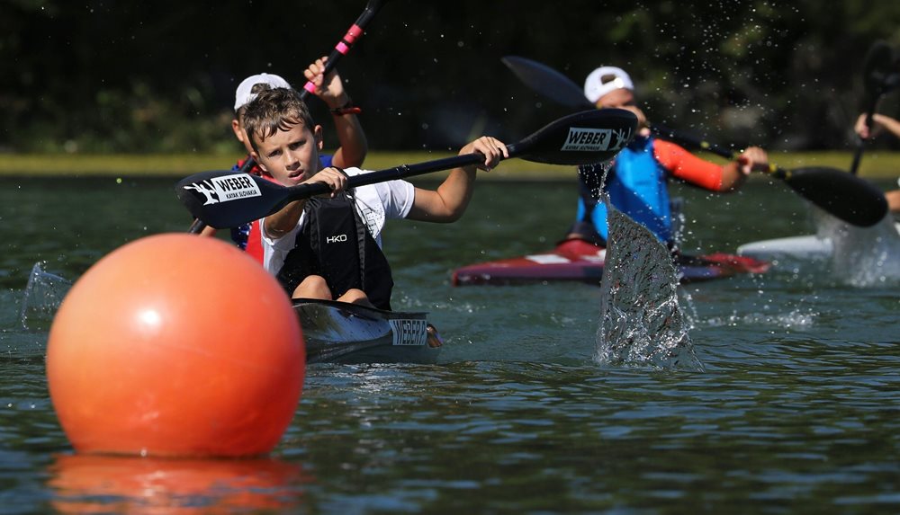 Children playing canoe polo.
